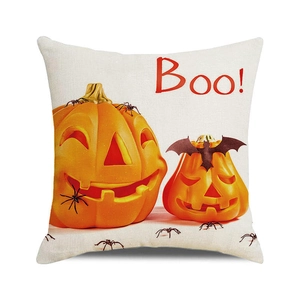 Detail of Halloween pumpkin cushion cover with Boo text and textured linen fabric