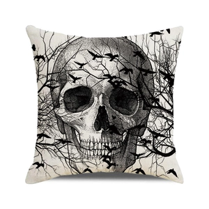 Detail of square throw pillow cover featuring gothic skull design and linen texture