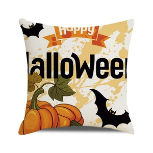 Macro shot of Halloween cushion cover with Happy Halloween lettering and pumpkin design