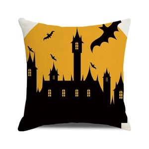 Detailed texture of burlap Halloween pillowcase featuring castle silhouettes and bats
