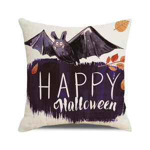 Detail of Halloween cushion cover with bat print and Happy Halloween text on linen fabric