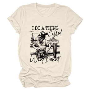 Detail of western cowboy graphic print on oat-colored short sleeve cotton t-shirt