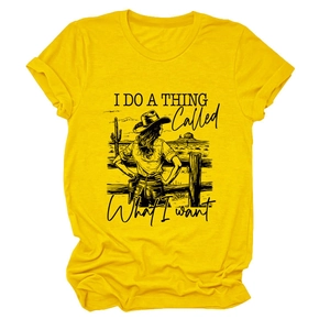 Detail of yellow cotton t-shirt featuring a vintage western graphic with desert scenery