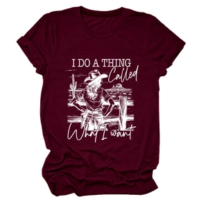 Detail of burgundy T-shirt with graphic print of girl in hat and desert cactus
