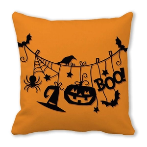 Detail of Halloween pillowcase with orange background featuring black Boo text and pumpkin icons