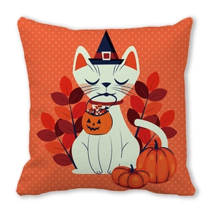 Detail of cartoon white cat with wizard hat and pumpkin on orange dotted pillowcase