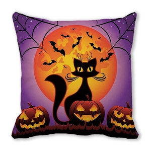 Detail of Halloween pillow featuring cartoon black cat, moon and glowing Jack-o'-lanterns