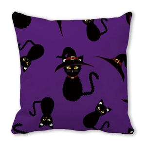 Detail view of purple Halloween pillowcase featuring cartoon black cats in wizard hats