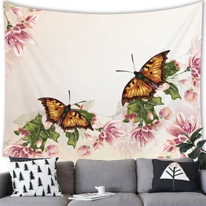 Macro detail of butterfly and pink flower tapestry hanging above a gray sofa set
