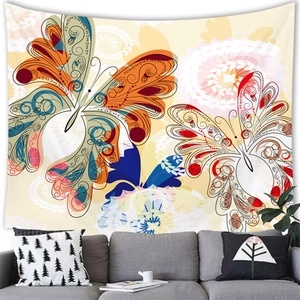 Close-up of colorful butterfly tapestry hung above a sofa in a bohemian style room