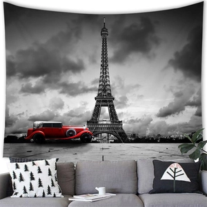 Detail of Eiffel Tower tapestry with a red vintage car over a modern grey sofa