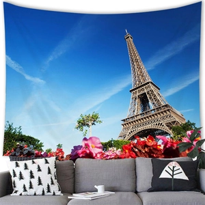 French Eiffel Tower tapestry wall hanging with pink flowers in a modern living room