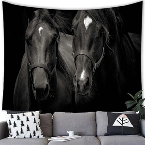 Detailed view of black and white horse tapestry hanging on a modern living room wall