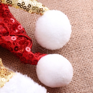 Funkelndes Weihnachts-Haarreif mit roten und goldenen Pailletten und weißem Plüschpompon