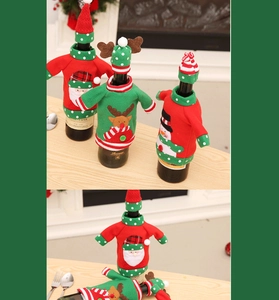 Detail of knitted Christmas wine bottle sweater with Santa Claus and reindeer embroidery