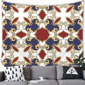 Detailed baroque floral tapestry hung over a modern sofa in a styled living room decor