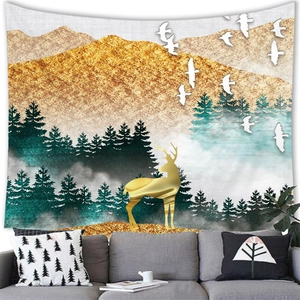 Detailed close-up of decorative landscape tapestry featuring golden deer and mountain peaks