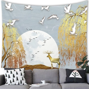 Detail of wall tapestry featuring golden deer and moon over a sofa in a modern room