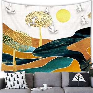 Detail of artistic mountain landscape tapestry above a gray sofa in a modern living room