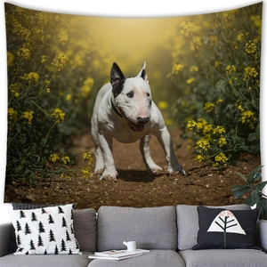 Detail of cute Bull Terrier tapestry hanging over sofa in a cozy home setting