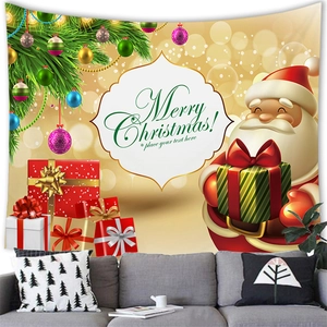 Detail of Christmas wall tapestry featuring Santa Claus, gifts and golden bokeh background