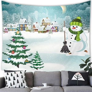 Christmas wall tapestry with snowman and tree hanging above a cozy sofa in a living room