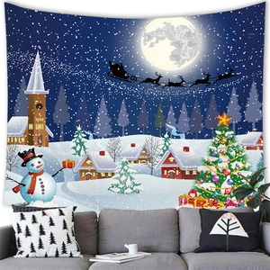 Christmas snowman and Santa village wall tapestry hanging above a modern living room sofa