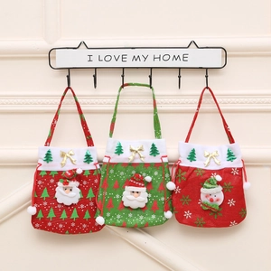 Close-up of festive Christmas gift bags with 3D Santa and snowman doll decorations