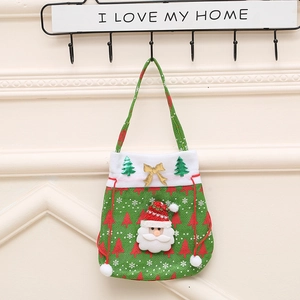 Detail of green Christmas gift bag featuring 3D Santa Claus applique and golden bow