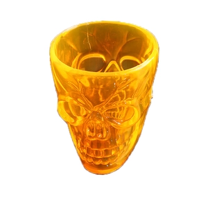 Translucent orange skull head mug with 3D bone details for Halloween party decoration