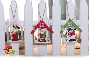 Three-piece set of wooden Christmas house ornaments with reindeer, Santa, and snowman designs