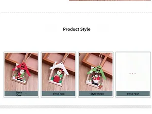 Detailed view of four laser-cut wooden Christmas house pendants with festive painted motifs