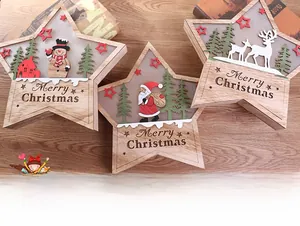 Detail of wooden Christmas star ornaments featuring 3D cutout snowman and reindeer scenes