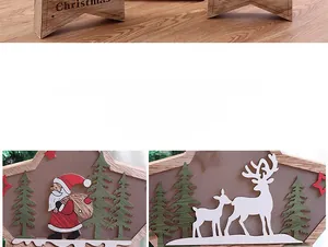 Detail of wooden Christmas star ornament with Santa and deer festive carvings