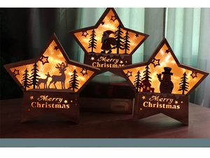 Detail of warm LED Christmas star ornaments featuring laser-cut elk and snowman motifs