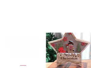 Close-up of wooden star ornament featuring miniature snowman and Christmas tree scene