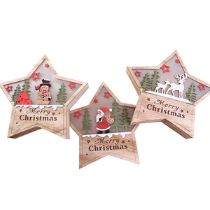 Three-piece wooden star Christmas ornaments with layered scenes and Merry Christmas text