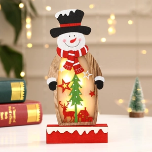 Detail of wooden snowman LED light ornament with cutout silhouettes of elk and forest