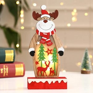 Close-up of wooden Christmas reindeer decor with internal LED lights and forest cutouts
