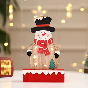 Detail of wooden snowman LED lamp with star cutouts and festive warm lighting decor