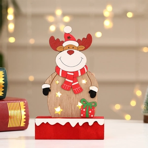 Detail of wooden Christmas reindeer decoration with glowing LED star cutout and red base