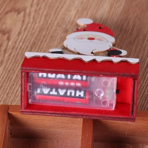 Lighted wooden Santa Claus ornament with battery compartment view and warm festive design