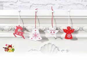 Close-up of wooden Christmas tree ornaments with reindeer and snowflake laser-cut designs