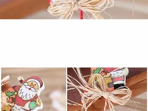 Detailsicht von Weihnachtsmann-Holzanhänger mit Bastschleife und bemalten Elementen
