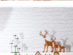 Detailansicht weihnachtlicher Holzornamente mit Weihnachtsmann, Geschenkbox und Deko