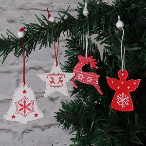 Set of red and white wooden Christmas tree ornaments with reindeer and angel patterns