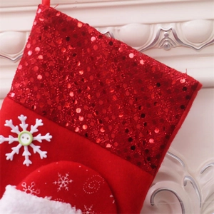 Close-up of red sequined Christmas stocking with 3D snowflake and button detail