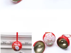 Detail of Christmas tin ball with Santa patterns and golden interior as hanging decor