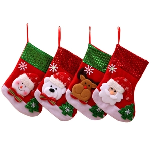 Set of four plush Christmas stockings with 3D Santa, snowman, reindeer, and bear figures