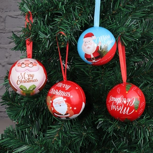 Set of four Christmas tinplate ball ornaments with Santa patterns and satin hanging ribbons